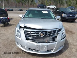 2013 Cadillac XTS Luxury z VIN 2G61P5S33D9170453, wystawiony jako IAAI lot #41928607 z przebiegiem 68 094 mil mil oraz . Historia ofert i sprzedaży dostępna na DreamBid. Obrazek 12.
