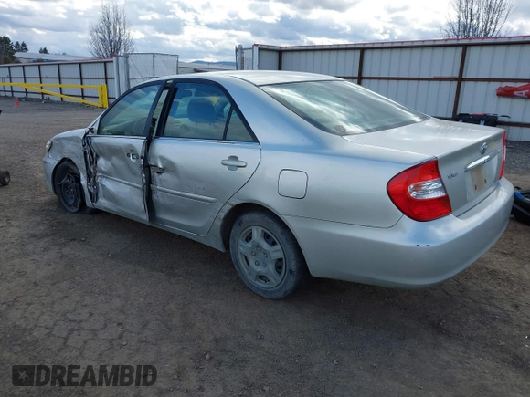 2004 Toyota Camry LE with VIN JTDBE32K640257695, listed as a IAAI auction lot 41837872 with 214,917 mi miles. Bid and sale history available at carsss.com. Image 3.