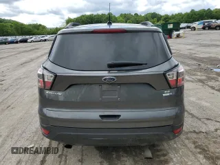 2017 Ford Escape SE z VIN 1FMCU9GD7HUB76204, wystawiony jako Copart lot #58334725 z przebiegiem Nie podano mil oraz Szkoda całkowita • Salvage title. Historia ofert i sprzedaży dostępna na DreamBid. Obrazek 6.