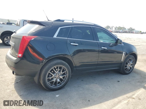 2014 Cadillac SRX Premium Collection with VIN 3GYFNDE35ES591071, listed as a Copart auction lot 57891265 with 134,560 mi miles and Salvage title. Bid and sale history available at DreamBid. Image 3.