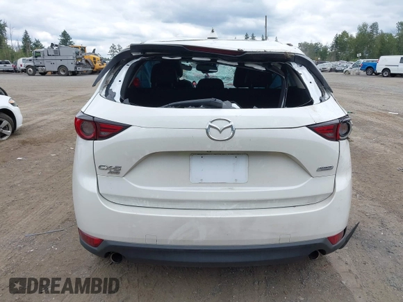 2018 Mazda CX-5 Grand Touring with VIN JM3KFBDM1J0382306, listed as a IAAI auction lot 42554947 with 121,303 mi miles and . Bid and sale history available at DreamBid. Image 16.