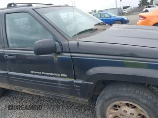 1998 Jeep Grand Cherokee Limited with VIN 1J4GZ78YXWC141912, listed as a IAAI auction lot 41972948 with 291,801 mi miles. Bid and sale history available at carsss.com. Image 6.