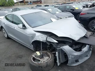 2017 Tesla Model S 100D with VIN 5YJSA1E24HF193563, listed as a IAAI auction lot 42120120 with 60,391 mi miles and . Bid and sale history available at DreamBid. Image 1.