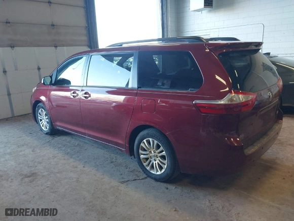 2015 Toyota Sienna XLE with VIN 5TDYK3DC1FS636211, listed as a IAAI auction lot 41710294 with 115,173 mi miles. Bid and sale history available at carsss.com. Image 3.