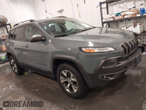 2015 Jeep Cherokee Trailhawk with VIN 1C4PJMBB4FW528633, listed as a IAAI auction lot 42147632 with 166,669 mi miles and . Bid and sale history available at DreamBid. Image 1.