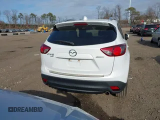 2014 Mazda CX-5 Grand Touring with VIN JM3KE4DY7E0425201, listed as a IAAI auction lot 41803597 with 118,867 mi miles. Bid and sale history available at carsss.com. Image 17.