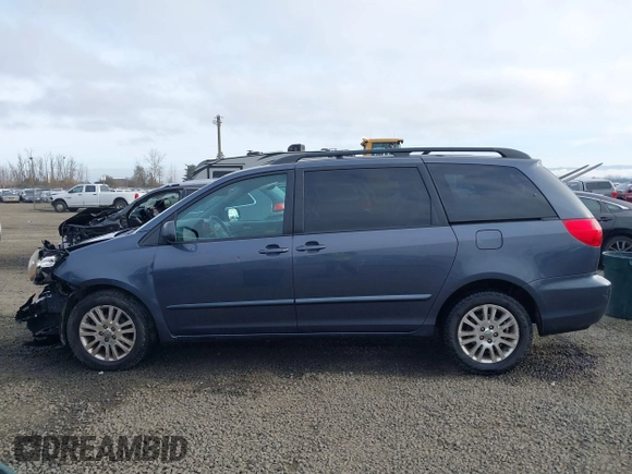 2008 Toyota Sienna XLE with VIN 5TDBK22C98S017300, listed as a IAAI auction lot 41433777 with 248,602 mi miles. Bid and sale history available at carsss.com. Image 14.