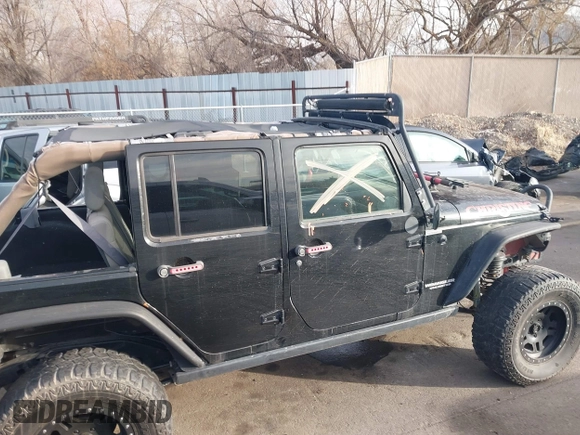 2009 Jeep Wrangler Unlimited Rubicon z VIN 1J4GA69159L749215, wystawiony jako IAAI lot #41489893 z przebiegiem 177 768 mil mil oraz . Historia ofert i sprzedaży dostępna na DreamBid. Obrazek 13.