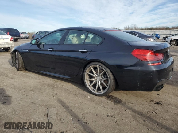 2014 BMW 6 Series 650i z VIN WBA6B2C51ED128896, wystawiony jako Copart lot #84801734 z przebiegiem 142 181 mil mil oraz Szkoda całkowita • Salvage title. Historia ofert i sprzedaży dostępna na DreamBid. Obrazek 2.