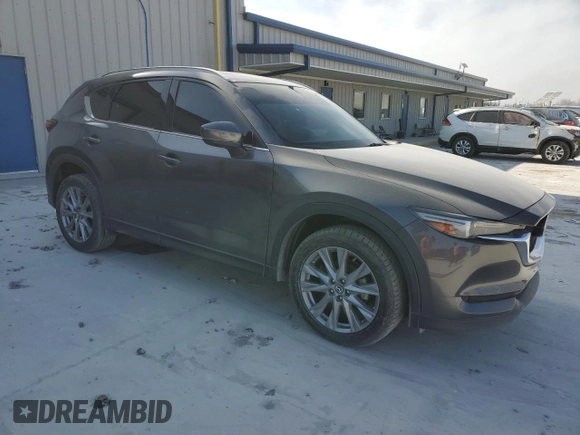 2021 Mazda CX-5 Grand Touring with VIN JM3KFBDM0M1464817, listed as a Copart auction lot 48821965 with 53,648 mi miles and Clean Title. Bid and sale history available at carsss.com. Image 4.