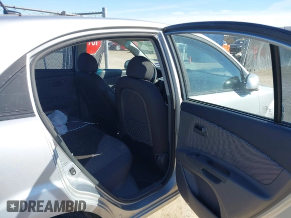 2009 Kia Rio LX with VIN KNADE243596530314, listed as a IAAI auction lot 41681050 with 114,831 mi miles. Bid and sale history available at carsss.com. Image 8.