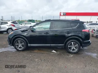 2018 Toyota RAV4 XLE with VIN 2T3WFREV9JW412755, listed as a IAAI auction lot 41889960 with 216,451 mi miles and . Bid and sale history available at carsss.com. Image 14.