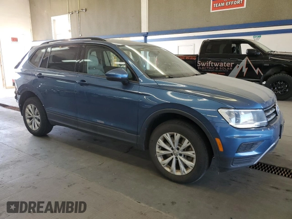 2019 Volkswagen Tiguan S with VIN 3VV0B7AX2KM197883, listed as a Copart auction lot 64978515 with 54,961 mi miles and Salvage title. Bid and sale history available at DreamBid. Image 4.