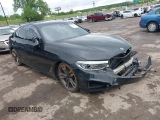 2019 BMW 5 Series M550i xDrive with VIN WBAJB9C53KB464754, listed as a IAAI auction lot 42116407 with 156,418 mi miles and . Bid and sale history available at DreamBid. Image 1.