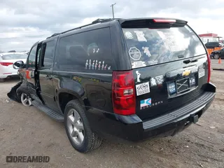 2013 Chevrolet Suburban LT with VIN 1GNSKJE70DR284785, listed as a IAAI auction lot 41838484 with 113,696 mi miles. Bid and sale history available at carsss.com. Image 3.