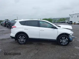 2018 Toyota RAV4 LE with VIN 2T3BFREV7JW851015, listed as a IAAI auction lot 42354042 with 94,603 mi miles and . Bid and sale history available at DreamBid. Image 13.