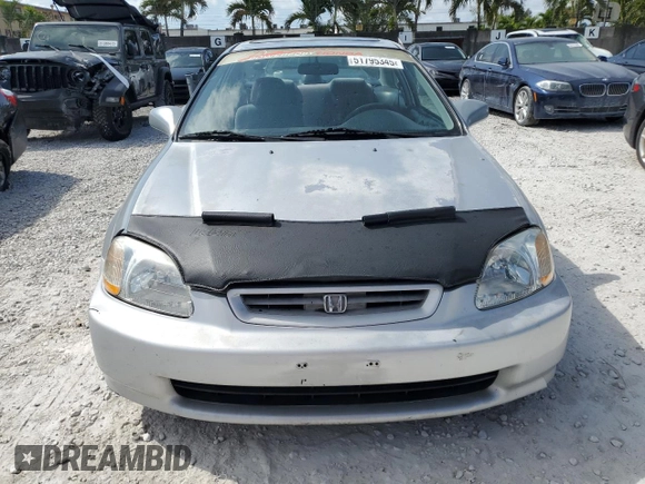 1997 Honda Civic EX z VIN 1HGEJ8143VL043998, wystawiony jako Copart lot #51795345 z przebiegiem 129 631 mil mil oraz Nie do naprawy • Non repairable. Historia ofert i sprzedaży dostępna na DreamBid. Obrazek 5.