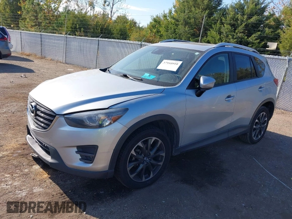 2016 Mazda CX-5 Grand Touring z VIN JM3KE2DY3G0712249, wystawiony jako IAAI lot #37910910 z przebiegiem 262 058 mil mil oraz . Historia ofert i sprzedaży dostępna na DreamBid. Obrazek 2.