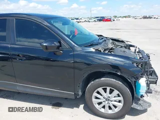 2014 Mazda CX-5 Sport with VIN JM3KE2BE9E0402015, listed as a IAAI auction lot 42098197 with 65,328 mi miles and . Bid and sale history available at carsss.com. Image 19.