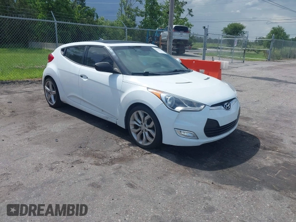 2012 Hyundai Veloster w/Gray Int z VIN KMHTC6ADXCU050034, wystawiony jako IAAI lot #42506584 z przebiegiem 142 514 mil mil oraz . Historia ofert i sprzedaży dostępna na DreamBid. Obrazek 1.