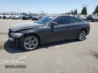 2014 BMW 4 Series 435i xDrive with VIN WBA3R5C51EK187636, listed as a Copart auction lot 63343715 with 166,286 mi miles and Salvage title. Bid and sale history available at DreamBid. Image 1.