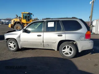 2005 GMC Envoy SLE with VIN 1GKDT13S452194933, listed as a IAAI auction lot 41426512 with 176,897 mi miles. Bid and sale history available at carsss.com. Image 14.