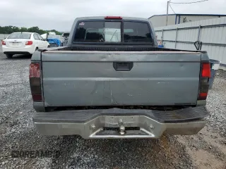 2000 Nissan Frontier XE z VIN 1N6ED27T2YC311037, wystawiony jako Copart lot #57901285 z przebiegiem Nie podano mil oraz Szkoda całkowita • Salvage title. Historia ofert i sprzedaży dostępna na DreamBid. Obrazek 6.