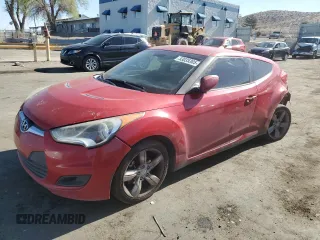 2014 Hyundai Veloster z VIN KMHTC6ADXEU196792, wystawiony jako Copart lot #53035305 z przebiegiem 129 773 mil mil oraz Szkoda całkowita • Salvage title. Historia ofert i sprzedaży dostępna na DreamBid. Obrazek 1.