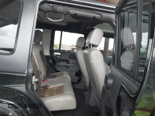 2008 Jeep Wrangler Unlimited Sahara with VIN 1J8GA59128L542384, listed as a IAAI auction lot 42184176 with 152,768 mi miles and . Bid and sale history available at DreamBid. Image 8.