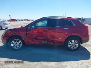 2014 Cadillac SRX with VIN 3GYFNAE36ES597007, listed as a IAAI auction lot 41675527 with 105,613 mi miles and . Bid and sale history available at DreamBid. Image 14.