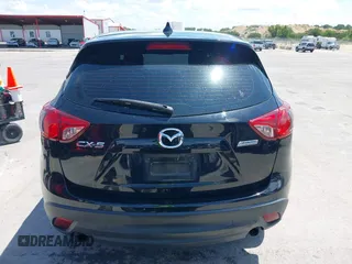 2014 Mazda CX-5 Sport with VIN JM3KE2BE9E0402015, listed as a IAAI auction lot 42098197 with 65,328 mi miles and . Bid and sale history available at carsss.com. Image 17.