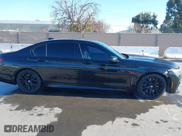 2022 BMW 7 Series 740i with VIN WBA7T2C02NCJ33925, listed as a IAAI auction lot 41377788 with 143,684 mi miles and . Bid and sale history available at carsss.com. Image 13.