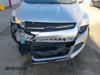 2016 Ford Escape SE with VIN 1FMCU9GX0GUA13421, listed as a IAAI auction lot 41788760 with 123,062 mi miles and . Bid and sale history available at DreamBid. Image 6.