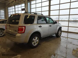 2010 Ford Escape XLT with VIN 1FMCU0D70AKB09942, listed as a IAAI auction lot 41572582 with 218,296 mi miles. Bid and sale history available at carsss.com. Image 4.