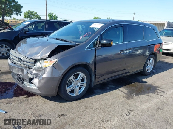 2012 Honda Odyssey Touring with VIN 5FNRL5H95CB057346, listed as a IAAI auction lot 42644094 with 114,712 mi miles and . Bid and sale history available at DreamBid. Image 18.