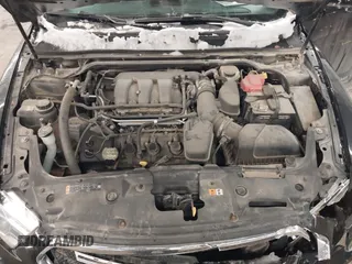 2014 Ford Taurus SEL with VIN 1FAHP2E87EG117653, listed as a IAAI auction lot 41589415 with 125,040 mi miles. Bid and sale history available at carsss.com. Image 10.