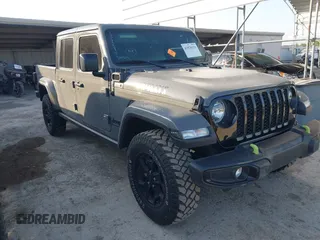 2022 Jeep Gladiator Texas Trail z VIN 1C6HJTAG7NL148818, wystawiony jako IAAI lot #41870129 z przebiegiem 23 342 mil mil oraz . Historia ofert i sprzedaży dostępna na DreamBid. Obrazek 1.