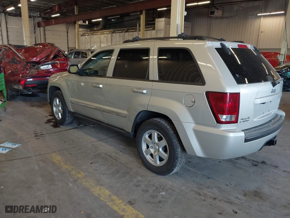 2010 Jeep Grand Cherokee Laredo with VIN 1J4RR4GT9AC106381, listed as a IAAI auction lot 41723268 with 180,008 mi miles. Bid and sale history available at carsss.com. Image 3.