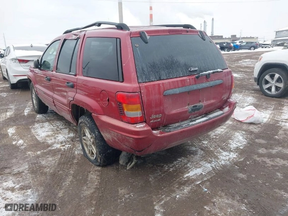 2004 Jeep Grand Cherokee Laredo with VIN 1J4GW48N64C331880, listed as a IAAI auction lot 41618664 with 287,453 mi miles. Bid and sale history available at carsss.com. Image 3.