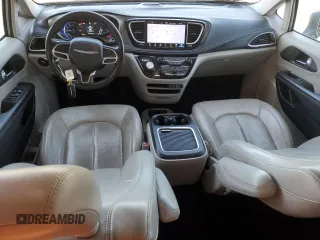 2021 Chrysler Pacifica Hybrid Touring L with VIN 2C4RC1L7XMR593911, listed as a Copart auction lot 57842415 with 74,910 mi miles and Salvage title. Bid and sale history available at DreamBid. Image 8.