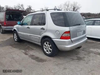 1999 Mercedes-Benz M-Class with VIN 4JGAB72E4XA113675, listed as a IAAI auction lot 41554604 with 230,092 mi miles. Bid and sale history available at carsss.com. Image 3.