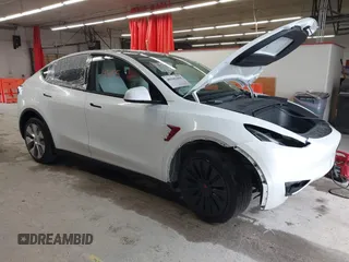 2023 Tesla Model Y Long Range with VIN 7SAYGDEE7PA100523, listed as a IAAI auction lot 40399455 with 18,885 mi miles and . Bid and sale history available at DreamBid. Image 1.