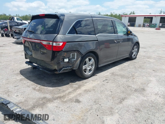 2013 Honda Odyssey Touring with VIN 5FNRL5H96DB068843, listed as a IAAI auction lot 42312176 with 115,804 mi miles and . Bid and sale history available at DreamBid. Image 4.