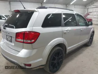 2013 Dodge Journey SXT with VIN 3C4PDCBBXDT661479, listed as a IAAI auction lot 42055731 with 151,963 mi miles. Bid and sale history available at carsss.com. Image 4.