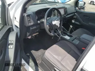 2023 Nissan Frontier S with VIN 1N6ED1CM1PN609767, listed as a Copart auction lot 64793675 with 36,700 mi miles and Salvage title. Bid and sale history available at DreamBid. Image 8.