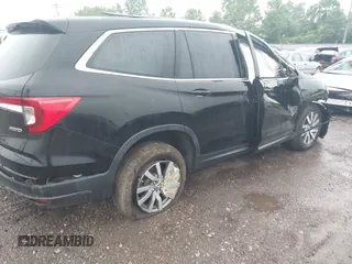 2021 Honda Pilot EX-L with VIN 5FNYF6H59MB021022, listed as a IAAI auction lot 42713636 with Not provided miles and . Bid and sale history available at DreamBid. Image 4.