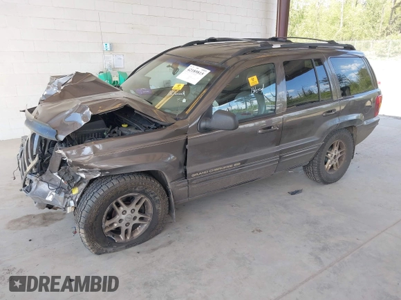1999 Jeep Grand Cherokee Limited z VIN 1J4GW68N0XC512229, wystawiony jako IAAI lot #42189815 z przebiegiem 230 028 mil mil oraz . Historia ofert i sprzedaży dostępna na DreamBid. Obrazek 2.
