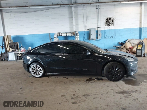2023 Tesla Model 3 with VIN 5YJ3E1EA5PF396413, listed as a IAAI auction lot 42188639 with 57,717 mi miles and . Bid and sale history available at DreamBid. Image 13.
