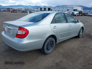2004 Toyota Camry LE with VIN JTDBE32K640257695, listed as a IAAI auction lot 41837872 with 214,917 mi miles. Bid and sale history available at carsss.com. Image 4.