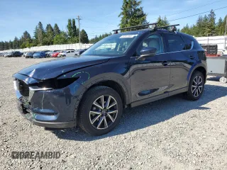 2018 Mazda CX-5 Grand Touring z VIN JM3KFBDM5J0379246, wystawiony jako Copart lot #58587865 z przebiegiem 46 339 mil mil oraz Szkody całkowita. Historia ofert i sprzedaży dostępna na DreamBid. Obrazek 1.
